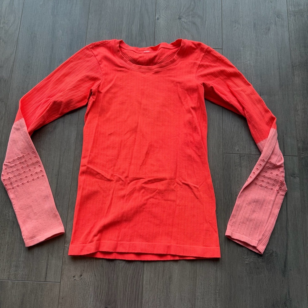 EUC Alo Yoga Exhale long sleeve top in neon orange/light pink